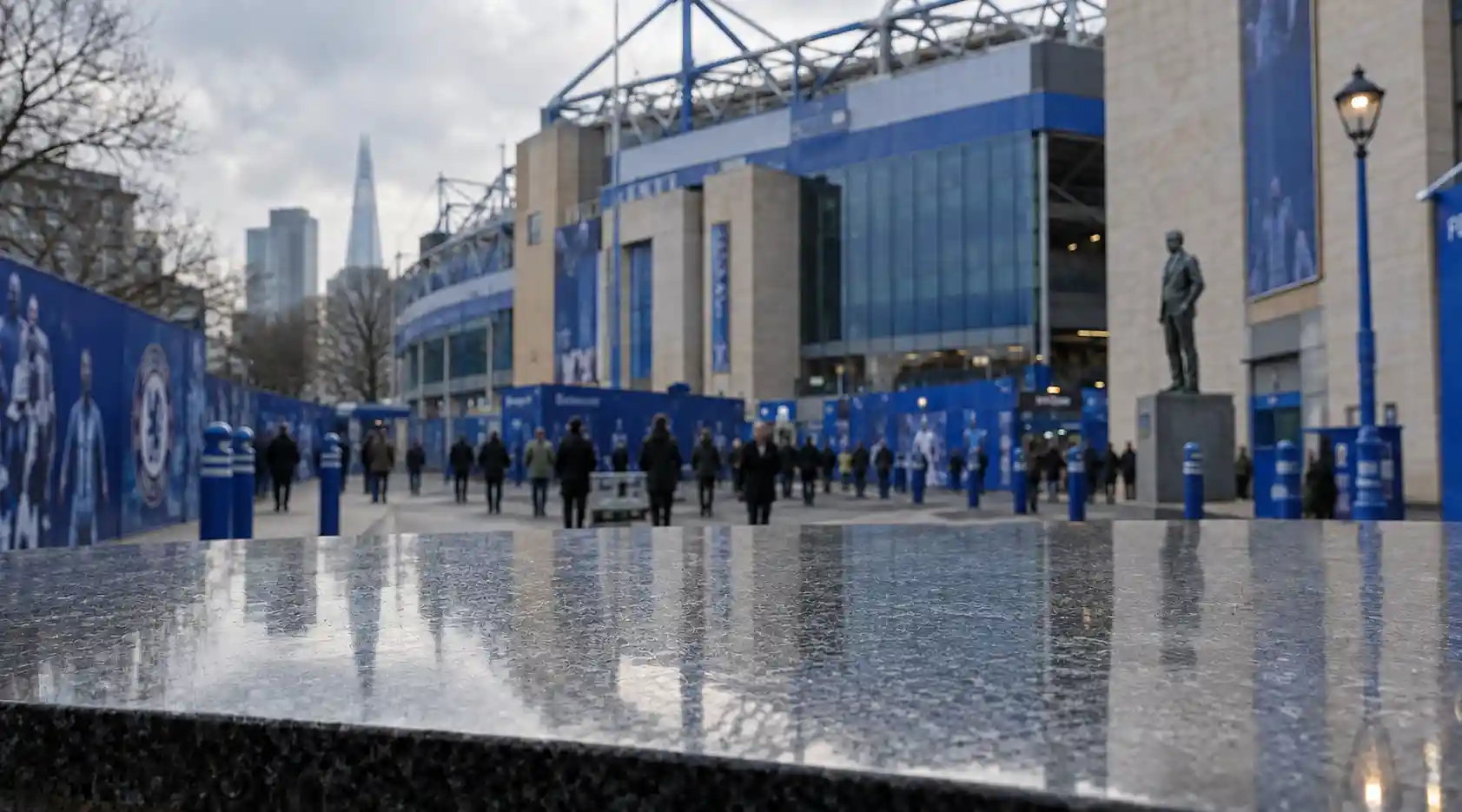 Stamford Bridge and financial documents representing the frozen proceeds from Chelsea Football Club's 2022 sale
