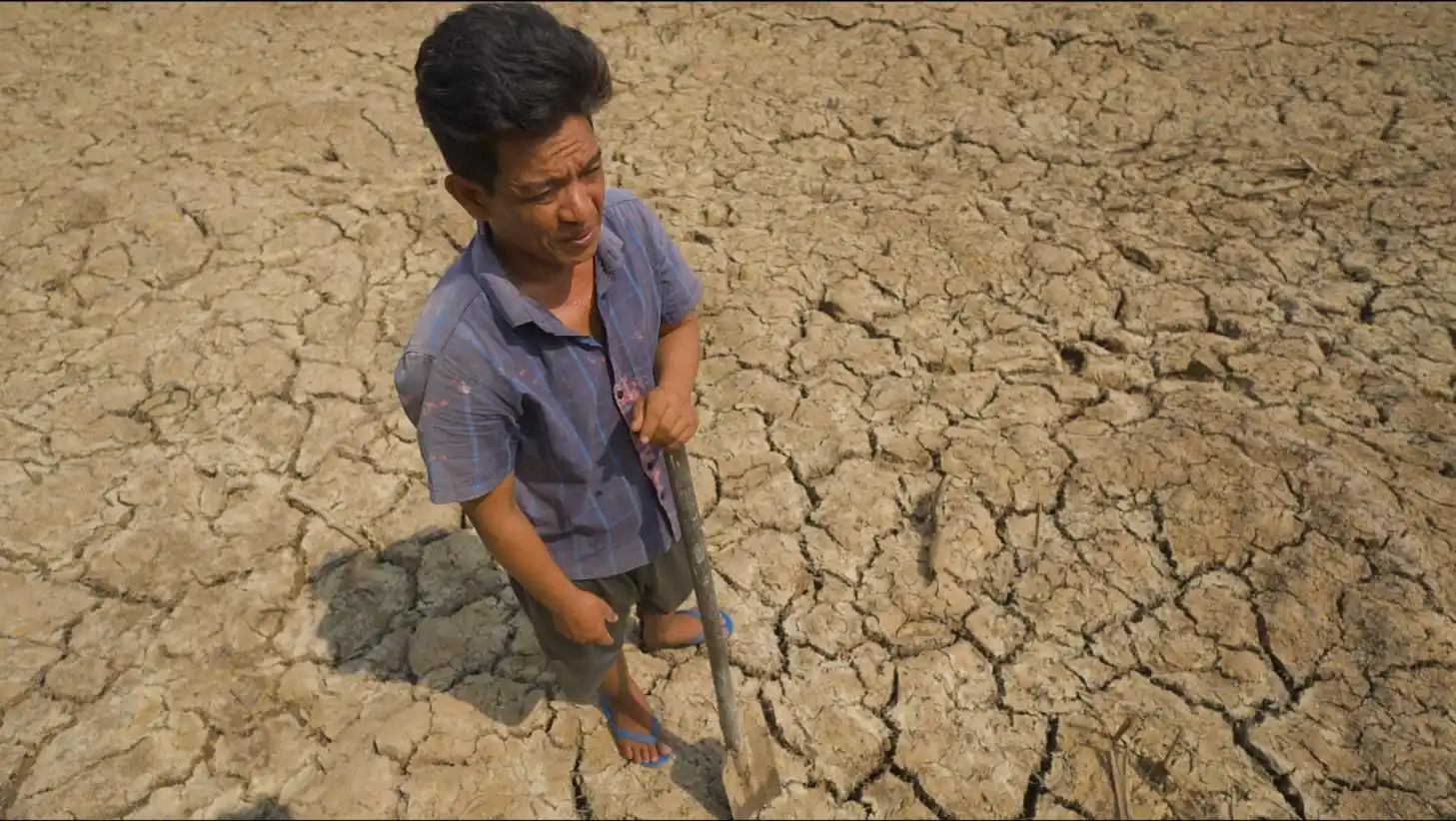 Parched agricultural fields and receding reservoirs in Southeast Asia, illustrating the severe drought risks brought by the intensifying 2026 El Niño weather pattern.