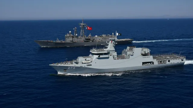 Indian and Pakistani naval warships operating in the North Arabian Sea near Oman during a tense maritime encounter
