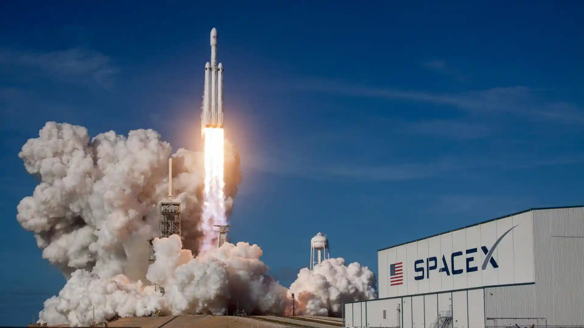 Rook autonomous cargo rocket deployed from a standard shipping container for rapid point-to-point delivery