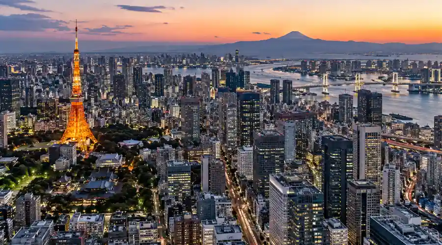 Tokyo financial district and semiconductor technology visualization representing Japan's AI-driven stock market rally