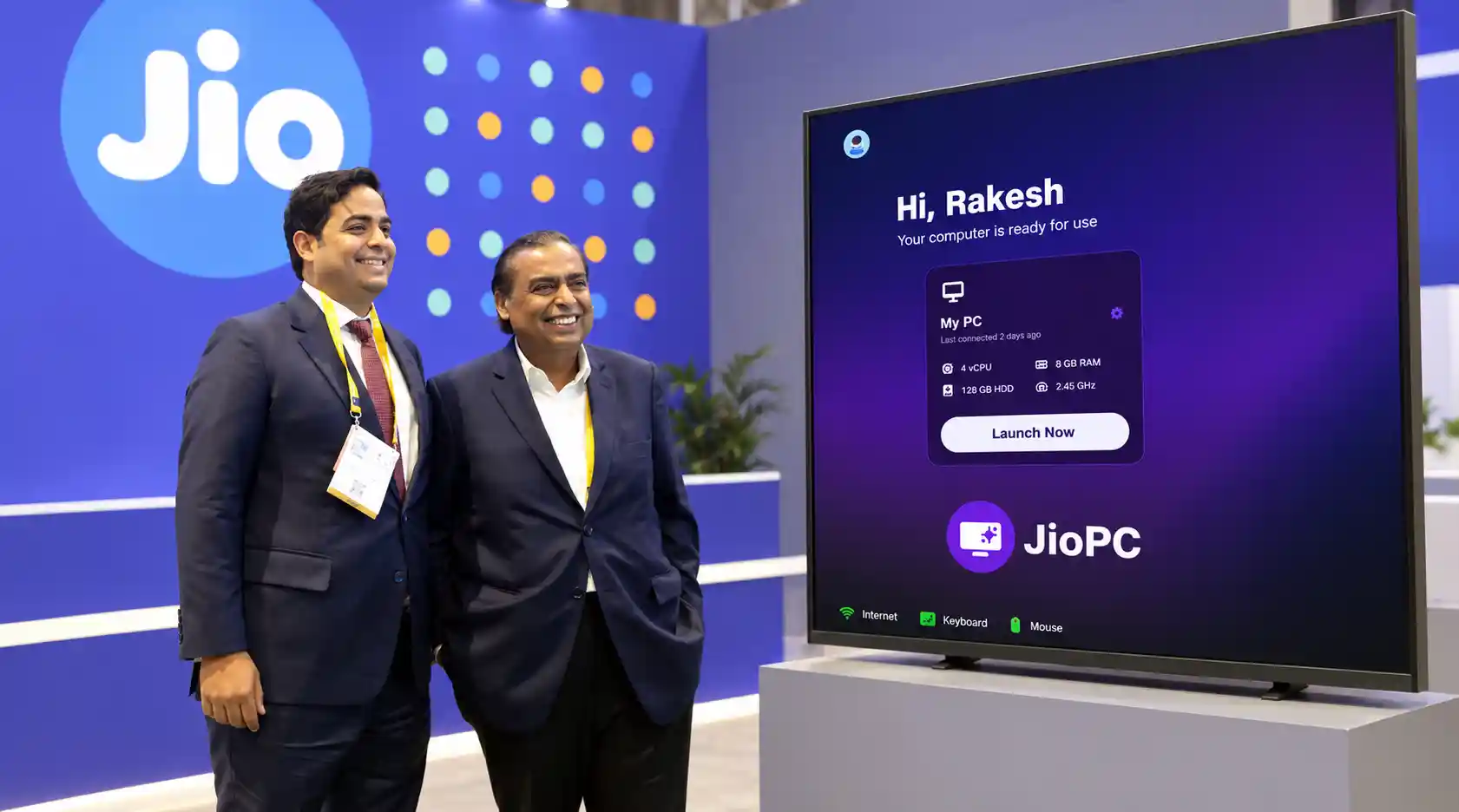 A television and older laptop connected to a cloud-powered JioPC virtual desktop for work, learning and AI applications