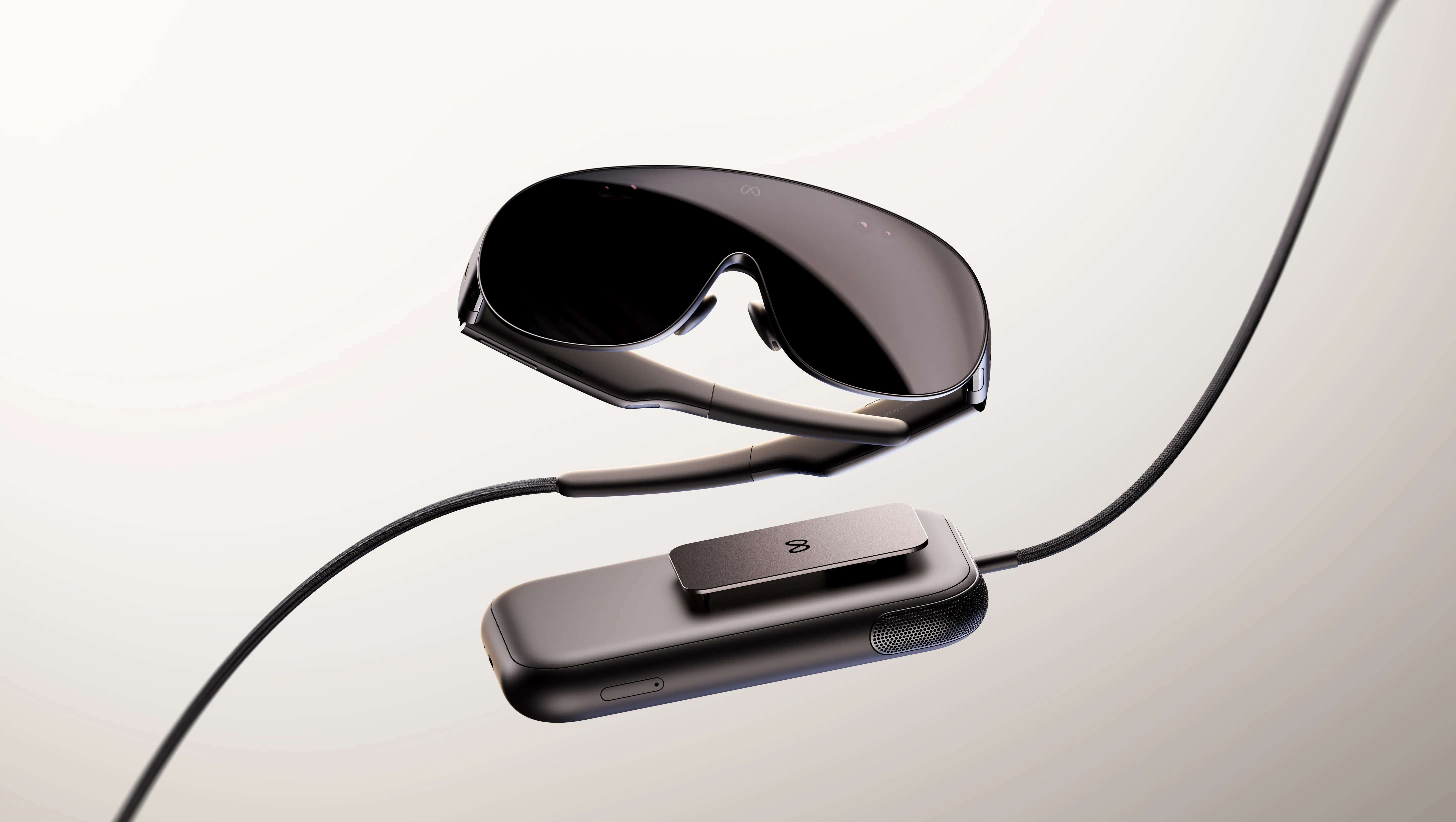 Meta VR Glasses headset next to its compute puck alongside Ray-Ban Meta Audio smart glasses