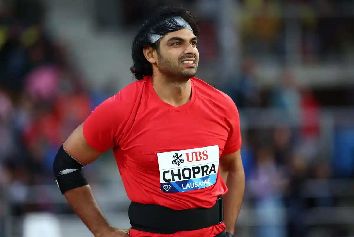 Neeraj Chopra competing in a javelin throw event.