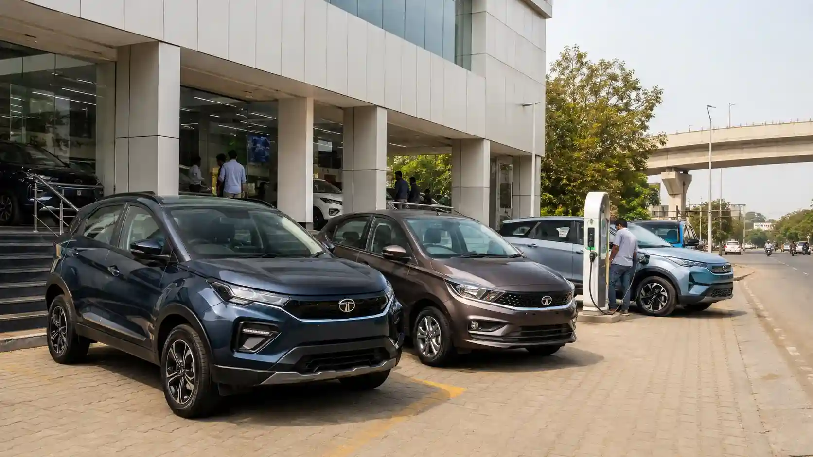 A line-up of Tata Motors passenger vehicles, including both conventional and electric models.